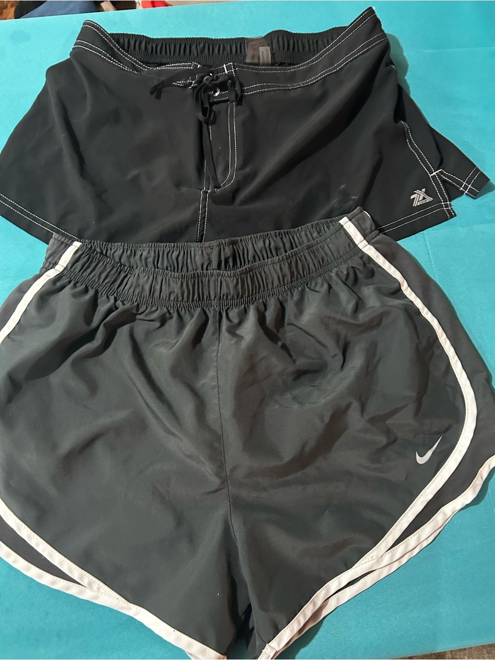 Black Nike and Reebok swim Shorts Duo